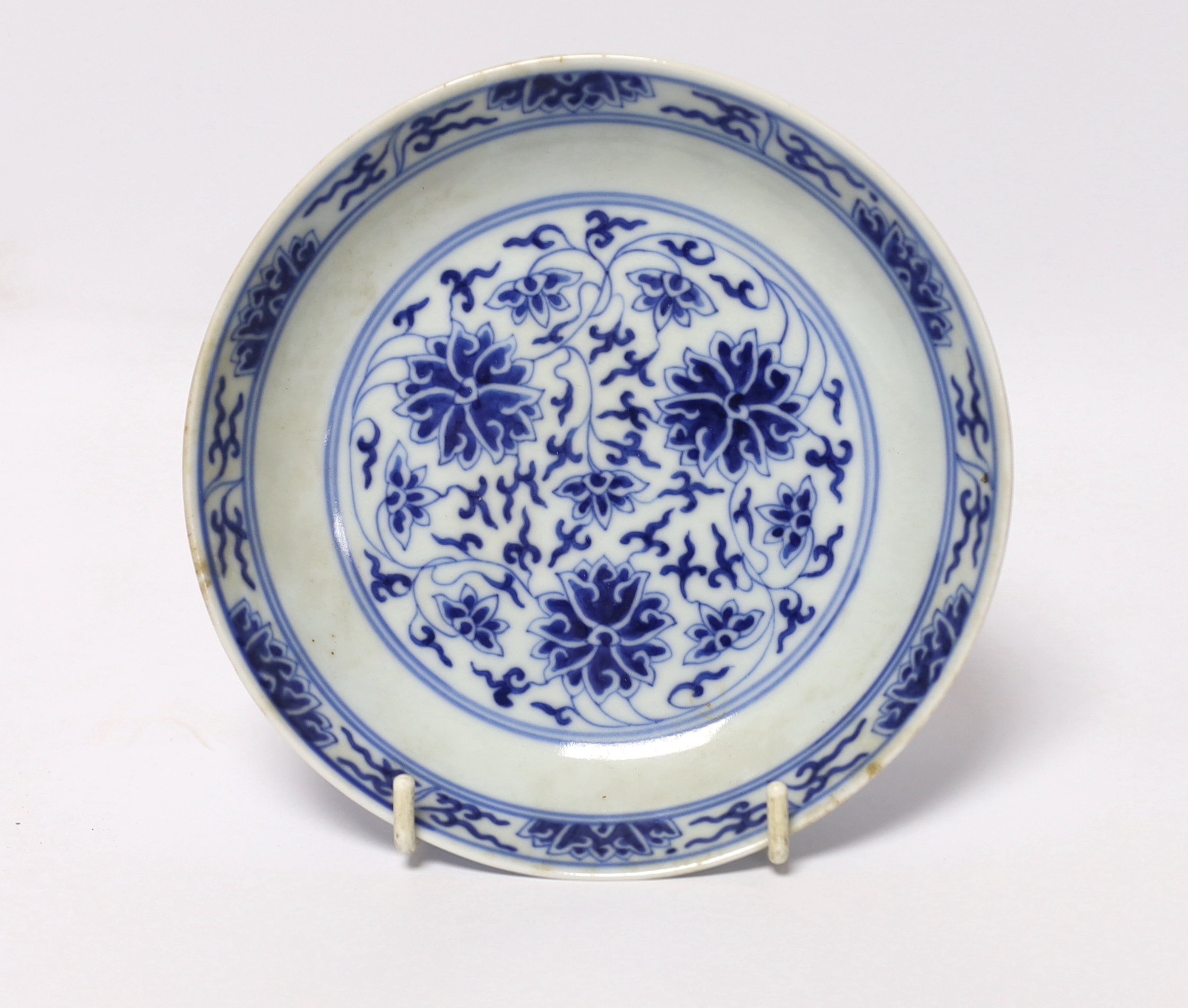 A Chinese blue and white lotus saucer dish, Guangxu mark and of the period (1875-1908), 15.5cm diameter